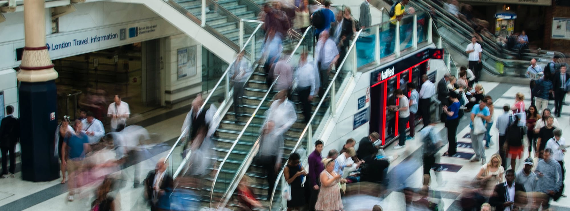 People walking through train station