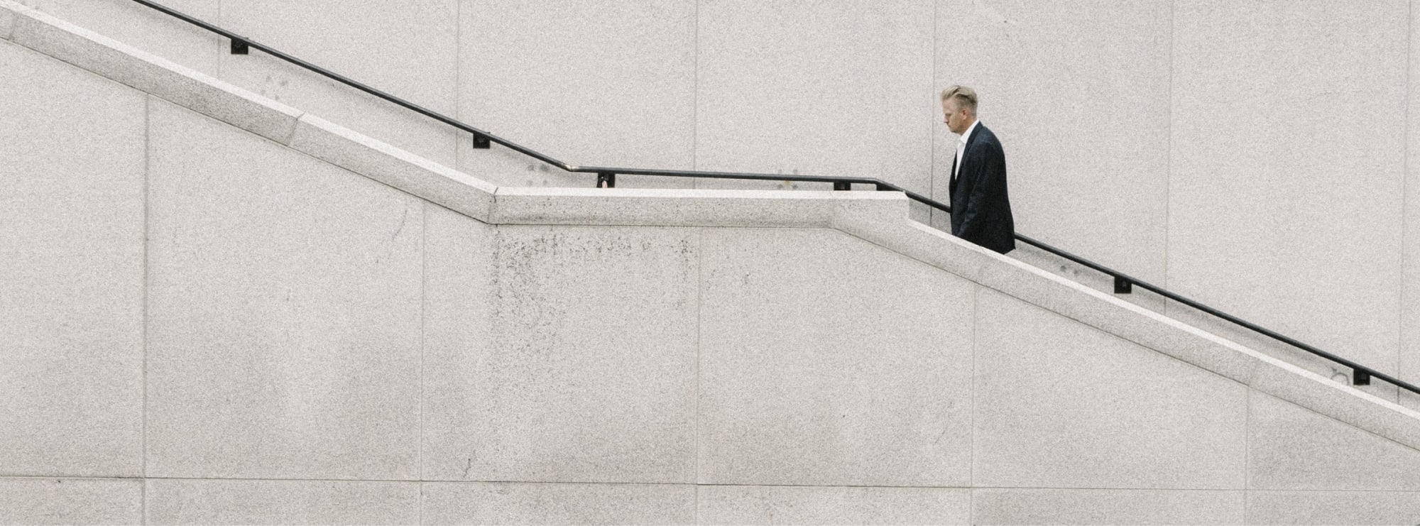 People walking up esculator