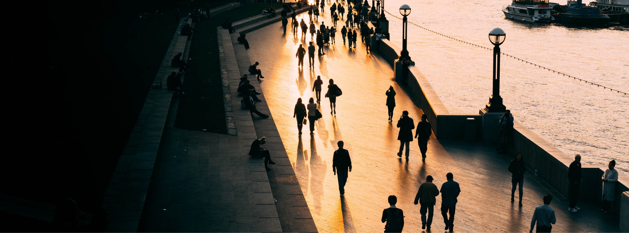 People walking across bridge in London