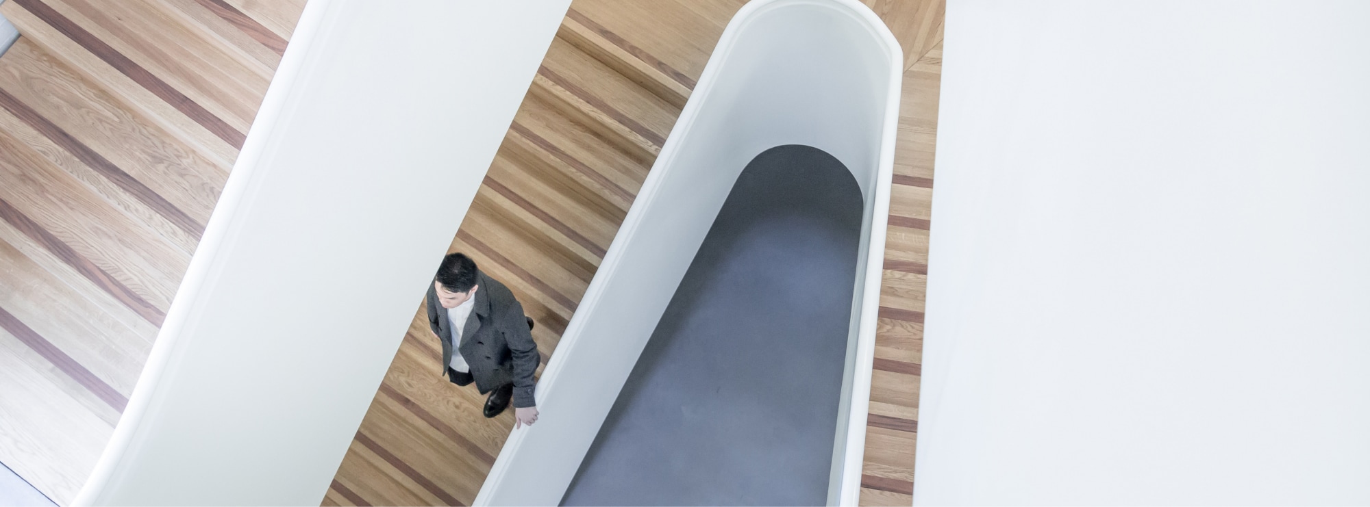 Business man walking down stairs