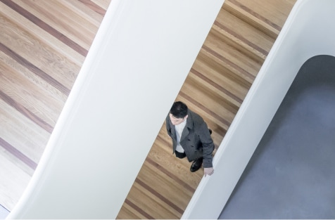 Business man walking down stairs