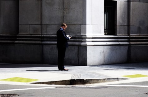 Commuters going down esculator