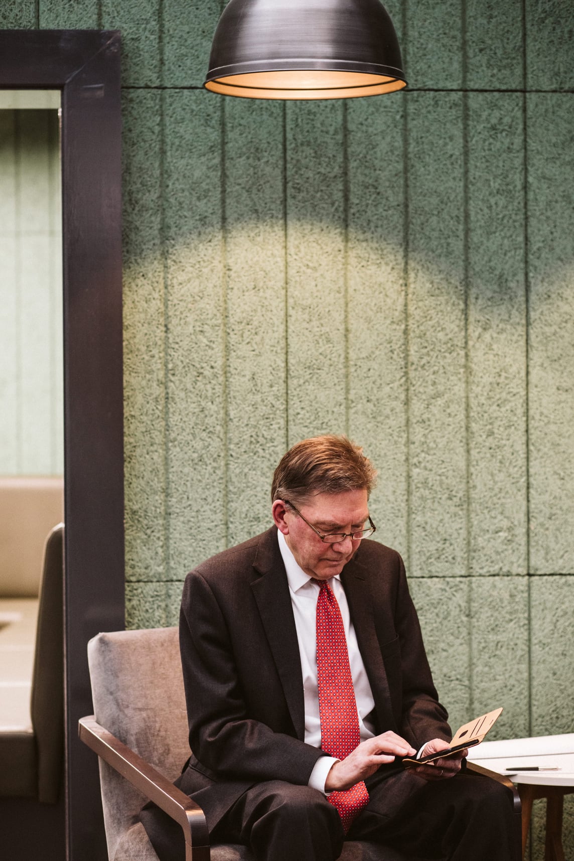 Andrew reading his phone