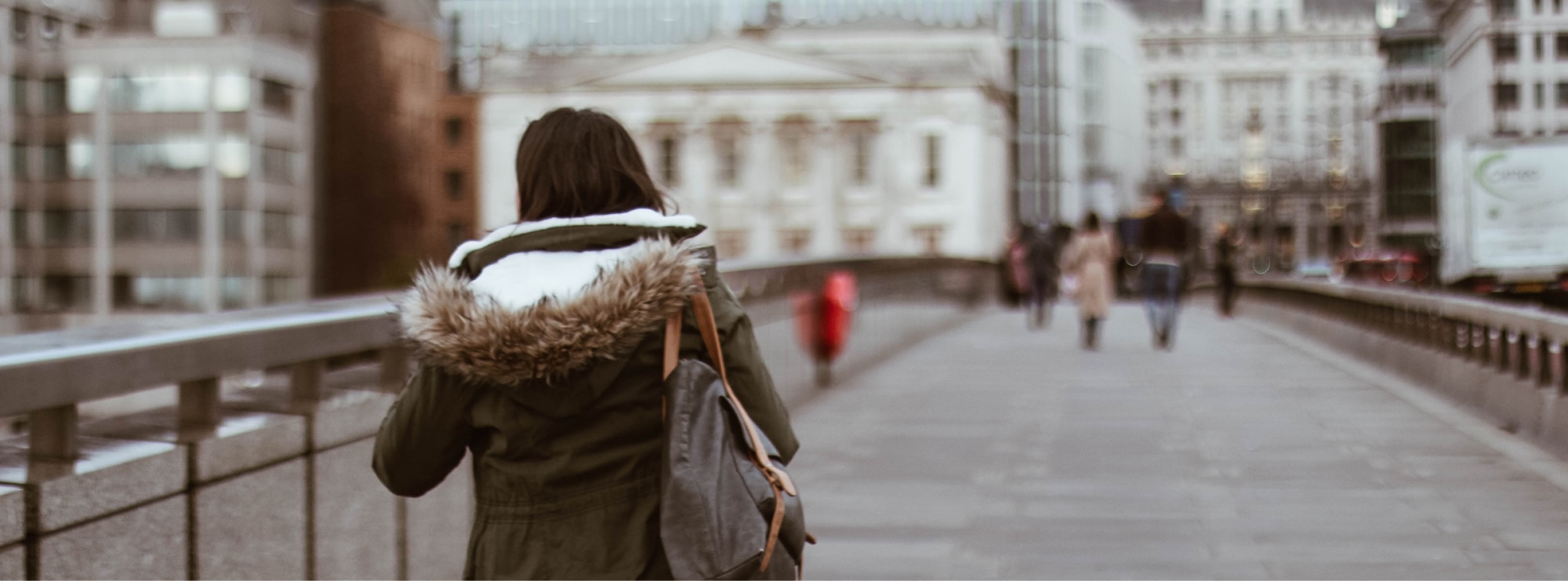 Woman walking across London Bridge