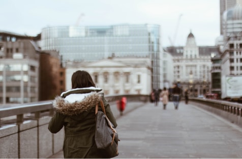 Woman walking across London Bridge